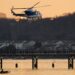 A US Park Police helicopter flies over the Potomac River