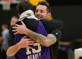 JJ Redick is hugged by Austin Reaves