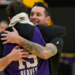 JJ Redick is hugged by Austin Reaves