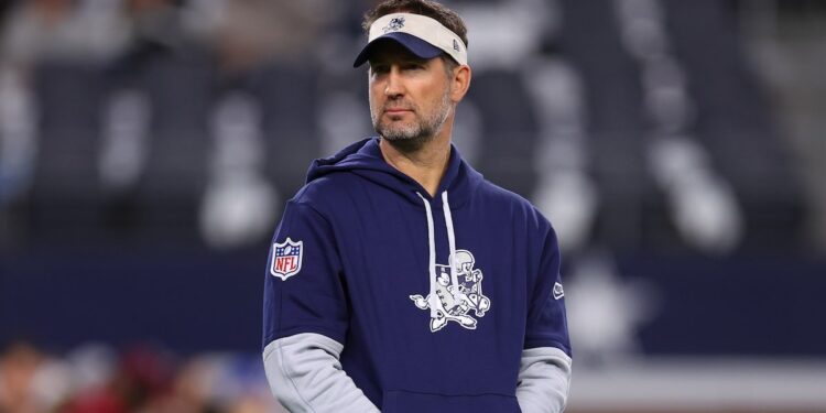 Dallas Cowboys offensive coordinator Brian Schottenheimer looks on prior to the game against the New York Giants at AT&amp;T Stadium on November 28, 2024 in Arlington, Texas. 