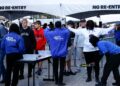 Fans pass through security check points as they enter the Caesars Superdome fan zone ahead of the Sugar Bowl NCAA College Football Playoff game, Thursday, Jan. 2, 2025, in New Orleans. 