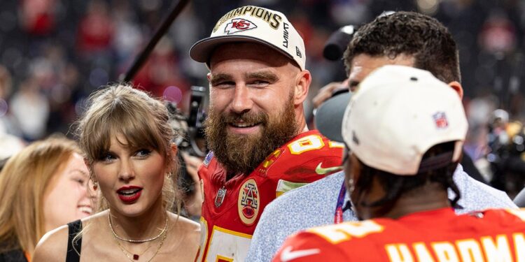 Travis Kelce and Taylor Swift react after a game