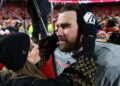 Taylor Swift and Travis Kelce celebrate on field