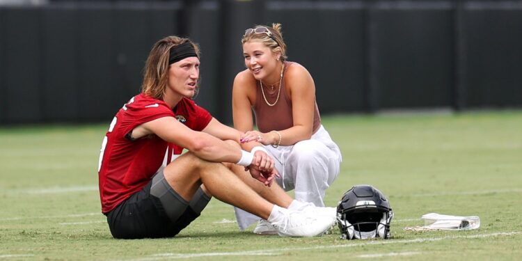 Trevor Lawrence talks with wife