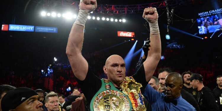 Tyson Fury raises his fists