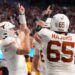 Texas Longhorns quarterback Quinn Ewers (3) celebrates with teammates after scoring a touchdown against the Arizona State Sun Devils during the second half of the Peach Bowl at Mercedes-Benz Stadium. 