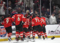 BOSTON, MASSACHUSETTS - FEBRUARY 20: Connor McDavid #97 of Team Canada is mobbed by teammates after scoring the game-winning goal during the first overtime period of the 4 Nations Face-Off Championship game between Team Canada and Team United States at TD Garden on February 20, 2025 in Boston, Massachusetts. (Photo by Brian Babineau/4NFO/World Cup of Hockey via Getty Images)