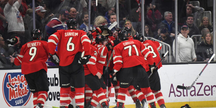 BOSTON, MASSACHUSETTS - FEBRUARY 20: Connor McDavid #97 of Team Canada is mobbed by teammates after scoring the game-winning goal during the first overtime period of the 4 Nations Face-Off Championship game between Team Canada and Team United States at TD Garden on February 20, 2025 in Boston, Massachusetts. (Photo by Brian Babineau/4NFO/World Cup of Hockey via Getty Images)