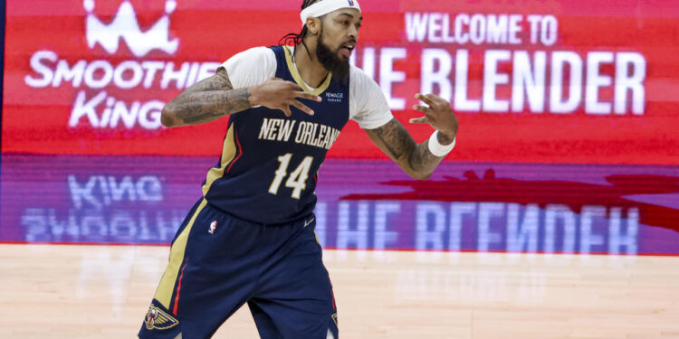 NEW ORLEANS, LOUISIANA - DECEMBER 5:  Brandon Ingram #14 of the New Orleans Pelicans reacts after scoring on a three point basket against the Phoenix Suns during the second half of a game at the Smoothie King Center on December 5, 2024 in New Orleans, Louisiana. NOTE TO USER: User expressly acknowledges and agrees that, by downloading and or using this photograph, User is consenting to the terms and conditions of the Getty Images License Agreement. (Photo by Derick E. Hingle/Getty Images)