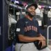 Boston Red Sox relief pitcher Kenley Jansen smiles as he does a radio interview after the team's win in a baseball game against the Atlanta Braves on Wednesday, May 10, 2023, in Atlanta. Jansen notched his 400th career save. (AP Photo/John Bazemore)