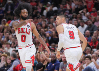 CHICAGO, IL - OCTOBER 30: Chicago Bulls guard Coby White (0) and Chicago Bulls center Nikola Vucevic (9)  during the second half against the Orlando Magic on October 30, 2024 at the United Center in Chicago, Illinois. (Photo by Melissa Tamez/Icon Sportswire via Getty Images)