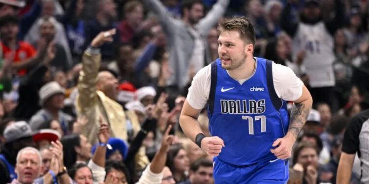 Dec 25, 2024; Dallas, Texas, USA; Dallas Mavericks guard Luka Doncic (77) celebrates after making a basket against the Minnesota Timberwolves during the first quarter at the American Airlines Center. Mandatory Credit: Jerome Miron-Imagn Images