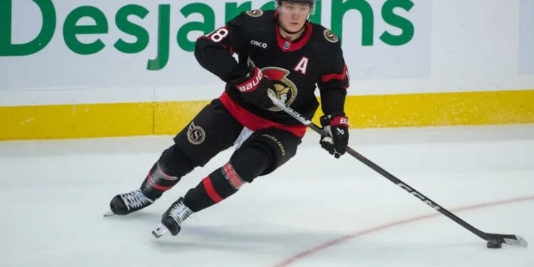 Nov 9, 2023; Ottawa, Ontario, CAN; Ottawa Senators center Tim Stutzle (18) skates with the puck in the third period against the Vancouver Canucks at the Canadian Tire Centre. credits: Marc DesRosiers-USA TODAY Sports