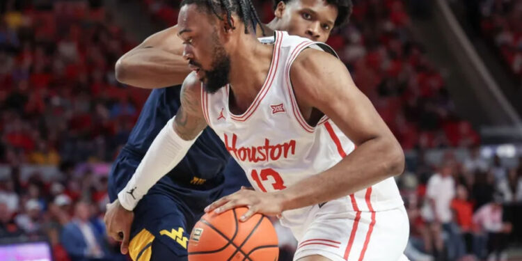 Jan 15, 2025; Houston, Texas, USA; Houston Cougars forward J'Wan Roberts (13) dribbles against West Virginia Mountaineers forward Amani Hansberry (13) in the first half at Fertitta Center. Mandatory Credit: Thomas Shea-Imagn Images