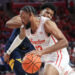 Jan 15, 2025; Houston, Texas, USA; Houston Cougars forward J'Wan Roberts (13) dribbles against West Virginia Mountaineers forward Amani Hansberry (13) in the first half at Fertitta Center. Mandatory Credit: Thomas Shea-Imagn Images