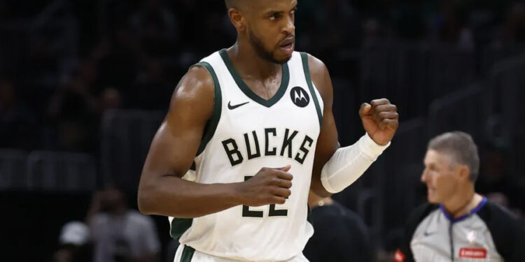 Mar 20, 2024; Boston, Massachusetts, USA; Milwaukee Bucks forward Khris Middleton (22) pumps his fist after hitting a basket against the Boston Celtics during the second half at TD Garden. Mandatory Credit: Winslow Townson-Imagn Images