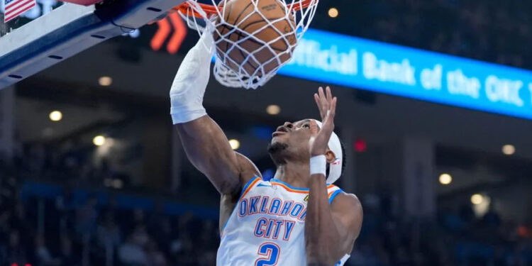 Oklahoma City guard Shai Gilgeous-Alexander (2) dunks the ball in the first quarter during an NAB game between Oklahoma City and Milwaukee at the Paycom Center in Oklahoma City on Monday, Feb. 3, 2025.PHOTO USA TODAY SPORTS IMAGES