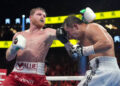 Sep 17, 2022; Las Vegas, Nevada, USA; Canelo Alvarez (red trunks) and Gennadiy Golovkin (white trunks) box during a super middleweight championship bout at T-Mobile Arena. Mandatory Credit: Joe Camporeale-Imagn Images