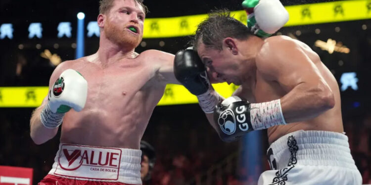 Sep 17, 2022; Las Vegas, Nevada, USA; Canelo Alvarez (red trunks) and Gennadiy Golovkin (white trunks) box during a super middleweight championship bout at T-Mobile Arena. Mandatory Credit: Joe Camporeale-Imagn Images