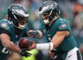 Jan 26, 2025; Philadelphia, PA, USA; Philadelphia Eagles quarterback Jalen Hurts (1) and running back Saquon Barkley (26) warm up before the NFC Championship game at Lincoln Financial Field. Mandatory Credit: Bill Streicher-Imagn Images