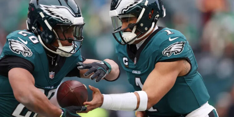 Jan 26, 2025; Philadelphia, PA, USA; Philadelphia Eagles quarterback Jalen Hurts (1) and running back Saquon Barkley (26) warm up before the NFC Championship game at Lincoln Financial Field. Mandatory Credit: Bill Streicher-Imagn Images