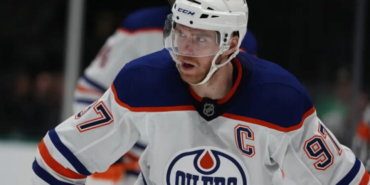 Oct 19, 2024; Dallas, Texas, USA; Edmonton Oilers center Connor McDavid (97) stands in the face off circle against the Dallas Stars in the third period at American Airlines Center. Mandatory Credit: Tim Heitman-Imagn Images