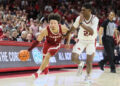 Feb 8, 2025; Fayetteville, Arkansas, USA; Alabama Crimson Tide guard mark Sears (1) drives against Arkansas Razorbacks forward Billy Richmond III (24) during the second half at Bud Walton Arena. Alabama won 85-81. Mandatory Credit: Nelson Chenault-Imagn Images