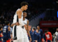 Feb 10, 2025; Washington, District of Columbia, USA; San Antonio Spurs center Victor Wembanyama (1) and guard De'Aaron Fox (4) react during the second quarter against the Washington Wizards at Capital One Arena. Mandatory Credit: Reggie Hildred-Imagn Images