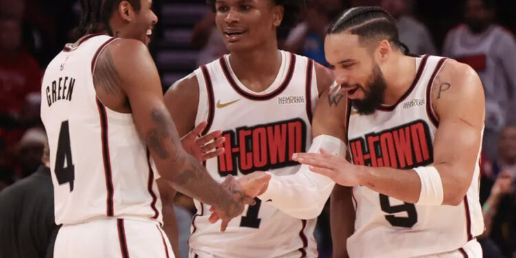 Feb 12, 2025; Houston, Texas, USA; Houston Rockets guard Jalen Green (4) and forward Amen Thompson (1) celebrate with forward Dillon Brooks (9) after a three point basket against the Phoenix Suns in the second half at Toyota Center. Mandatory Credit: Thomas Shea-Imagn Images