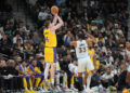 Nov 27, 2024; San Antonio, Texas, USA; Los Angeles Lakers guard Dalton Knecht (4) shoots over San Antonio Spurs guard Tre Jones (33) in the first half at Frost Bank Center. Mandatory Credit: Daniel Dunn-Imagn Images