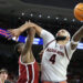 Feb 4, 2025; Auburn, Alabama, USA; Auburn Tigers forward Johni Broome (4) takes a shot over Oklahoma Sooners forward Jalon Moore (14) during the second half at Neville Arena. Mandatory Credit: John Reed-Imagn Images