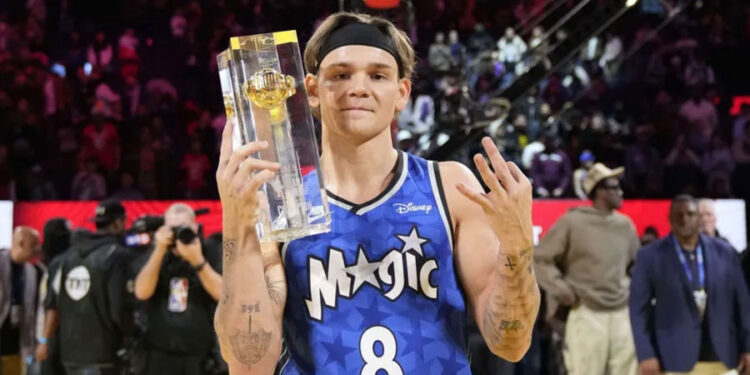 Feb 15, 2025; San Francisco, CA, USA; Osceola Magic guard Mac McClung celebrates with the trophy after winning the slam dunk competition during All Star Saturday Night ahead of the 2025 NBA All Star Game at Chase Center. Mandatory Credit: Kyle Terada-Imagn Images