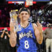 Feb 15, 2025; San Francisco, CA, USA; Osceola Magic guard Mac McClung celebrates with the trophy after winning the slam dunk competition during All Star Saturday Night ahead of the 2025 NBA All Star Game at Chase Center. Mandatory Credit: Kyle Terada-Imagn Images