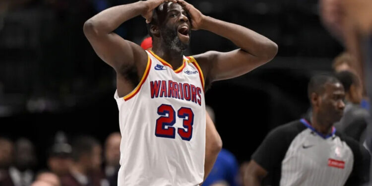 Feb 12, 2025; Dallas, Texas, USA; Golden State Warriors forward Draymond Green (23) reacts to a foul call on three point attempt by Dallas Mavericks guard Kyrie Irving (not pictured) during the fourth quarter at the American Airlines Center. Mandatory Credit: Jerome Miron-Imagn Images