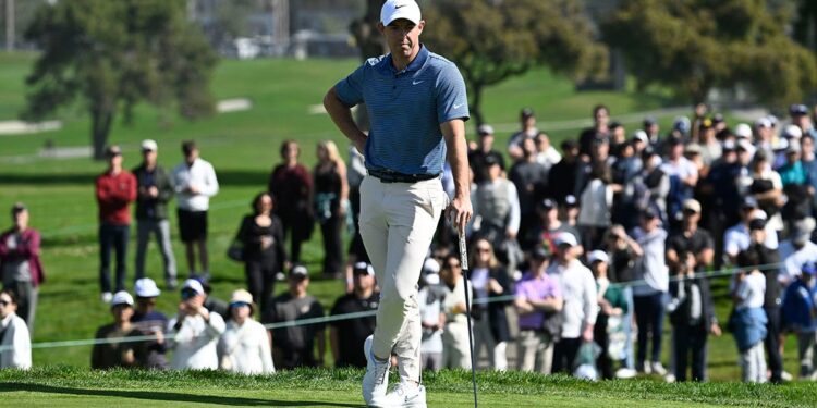 Rory McIlroy stands on green