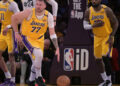 Feb 10, 2025; Los Angeles, California, USA; Los Angeles Lakers guard Luka Doncic (77) takes the ball down court as forward LeBron James (23) looks on against the Utah Jazz at Crypto.com Arena. Mandatory Credit: Jayne Kamin-Oncea-Imagn Images