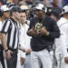 Dec 28, 2024; San Antonio, TX, USA; Colorado Buffaloes head coach Deion Sanders reacts with an official after a play during the second quarter against the Brigham Young Cougars at Alamodome. Mandatory Credit: Troy Taormina-Imagn Images