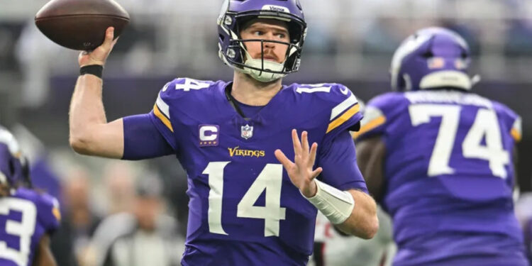 Dec 8, 2024; Minneapolis, Minnesota, USA; Minnesota Vikings quarterback Sam Darnold (14) throws a pass against the Atlanta Falcons during the first quarter at U.S. Bank Stadium. Mandatory Credit: Jeffrey Becker-Imagn Images