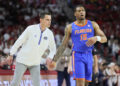 Jan 11, 2025; Fayetteville, Arkansas, USA; Florida Gators head coach Todd Golden talks to guard Alijah Martin (15) during the second half against the Arkansas Razorbacks at Bud Walton Arena. Mandatory Credit: Nelson Chenault-Imagn Images