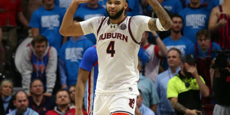 Feb 1, 2025; Oxford, Mississippi, USA; Auburn Tigers forward/center Johni Broome (4) reacts during the second half against the Mississippi Rebels at The Sandy and John Black Pavilion at Ole Miss. Mandatory Credit: Petre Thomas-Imagn Images