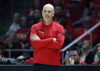 SALT LAKE CITY, UT - JANUARY 18: Head coach of the Utah Utes Craig Smith reacts to an official's call during their overtime win against the Brigham Young Cougars at the Jon M Huntsman Center on January 18, 2025 in Salt Lake City, Utah. (Photo by Chris Gardner/Getty Images)