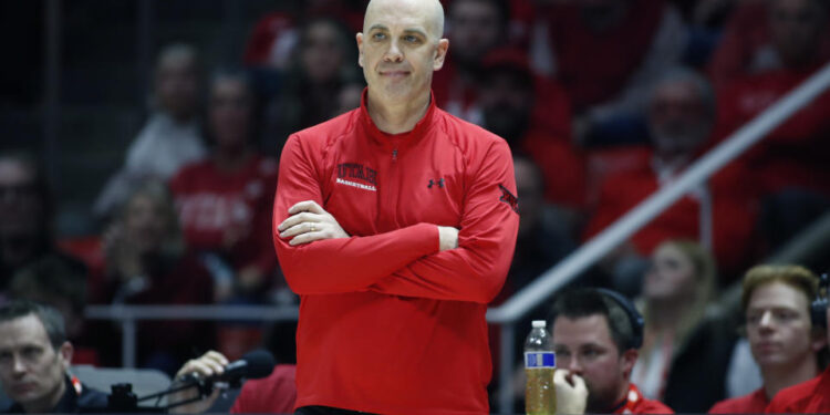 SALT LAKE CITY, UT - JANUARY 18: Head coach of the Utah Utes Craig Smith reacts to an official's call during their overtime win against the Brigham Young Cougars at the Jon M Huntsman Center on January 18, 2025 in Salt Lake City, Utah. (Photo by Chris Gardner/Getty Images)