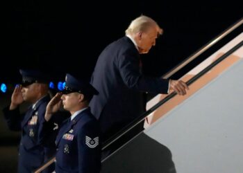 The president was pictured getting back onboard Air Force One more than an hour before the conclusion of the Big Game (AP)