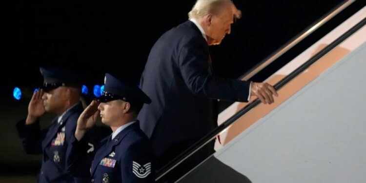 The president was pictured getting back onboard Air Force One more than an hour before the conclusion of the Big Game (AP)