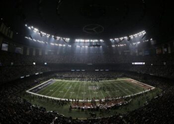 Fans, the Baltimore Ravens and the 49ers wait for power to return in the Superdome during Super Bowl XLVII in 2013.