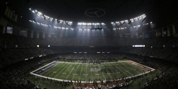 Fans, the Baltimore Ravens and the 49ers wait for power to return in the Superdome during Super Bowl XLVII in 2013.