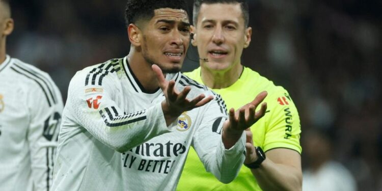 Real Madrid's Jude Bellingham gestures during the Spanish LaLiga soccer match between Real Madrid and Atletico Madrid, in Madrid, Spain,