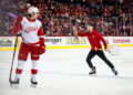 Feb 1, 2025; Calgary, Alberta, CAN; A Calgary Flames ice crew member picks up an octopus that was thrown on the ice during the third period of a game between the Calgary Flames and Detroit Red Wings at Scotiabank Saddledome<p>Brett Holmes&comma; Imagn Images</p>