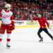 Feb 1, 2025; Calgary, Alberta, CAN; A Calgary Flames ice crew member picks up an octopus that was thrown on the ice during the third period of a game between the Calgary Flames and Detroit Red Wings at Scotiabank Saddledome<p>Brett Holmes&comma; Imagn Images</p>