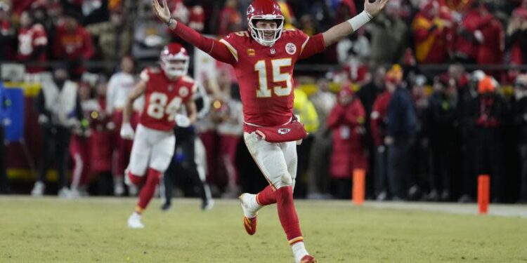 Kansas City Chiefs quarterback Patrick Mahomes (15) celebrates during an AFC Championship NFL football game against the Buffalo Bills Sunday, Jan. 26, 2025, in Kansas City, Mo. (AP Photo/Ed Zurga)